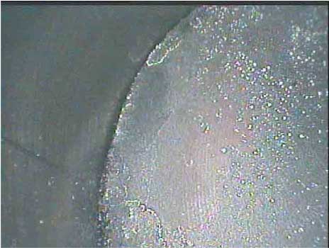 Image of a piston dome taken by a VJ-Advance video borescope during an automotive engine inspection