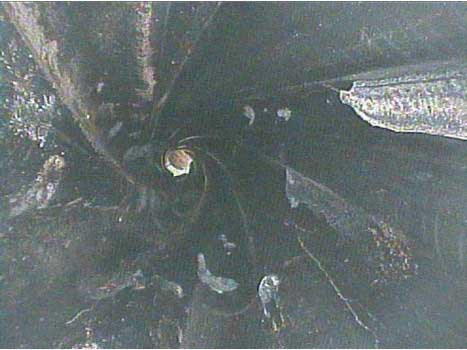 Long range view of a small bore mud motor stator taken by the VJ-Advance video borescope during an inspection.