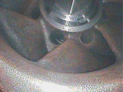 Image of pump vanes and through holes showing minor corrosion from lack of use taken by a VJ-Advance video borescope during an inspection.