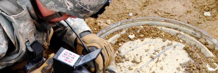 This is an image of someone using the VJ-Advance video borescope to inspect a possible bomb.