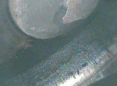 Image of coolant pooling in the combustion chamber taken by a VJ-Advance video borescope during a Waukeshaw 7042 Inspection