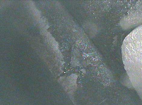 Image of an isolated coolant rupture taken by a VJ-Advance video borescope during a Waukeshaw 7042 Inspection