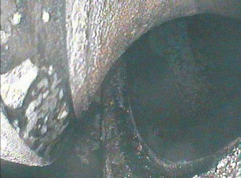 Image of intake valve corrosion taken by a VJ-Advance video borescope during a Waukeshaw 7042 Inspection