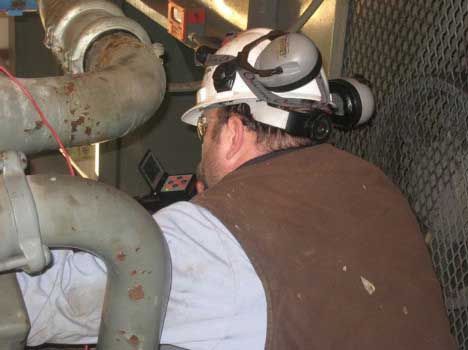 Image of a technician working on a natural gas compressor taken by a VJ-Advance video borescope during a Waukeshaw 7042 Inspection