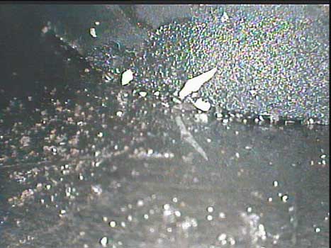 Chrysler engine FOD inside the combustion chamber photo taken by the VJ-Advance video borescope during an inspection