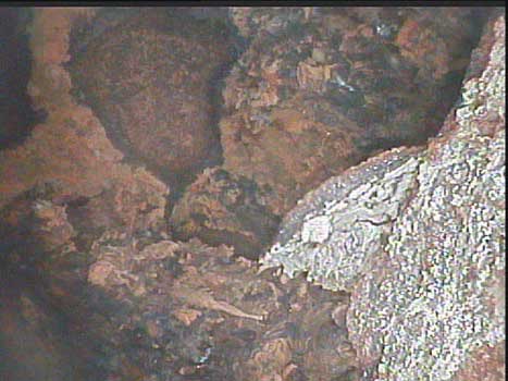 Oil well drill pipe debris seen during a corrosion inspection as shown through a VJ-Advance video borescope