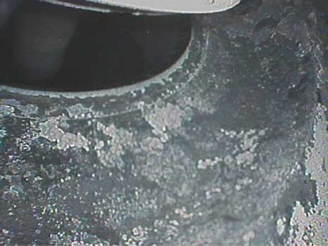Close up image of the valve seat showing deposits and corrosion taken with a VJ-Advance video borescope during a small engine inspection