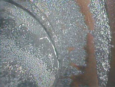Image of an exhaust valve that has been carboned taken with a VJ-Advance video borescope during a small engine inspection