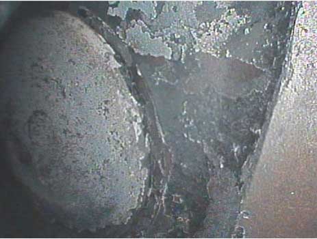 Image showing the full view of an exhaust valve taken with a VJ-Advance video borescope during a small engine inspection